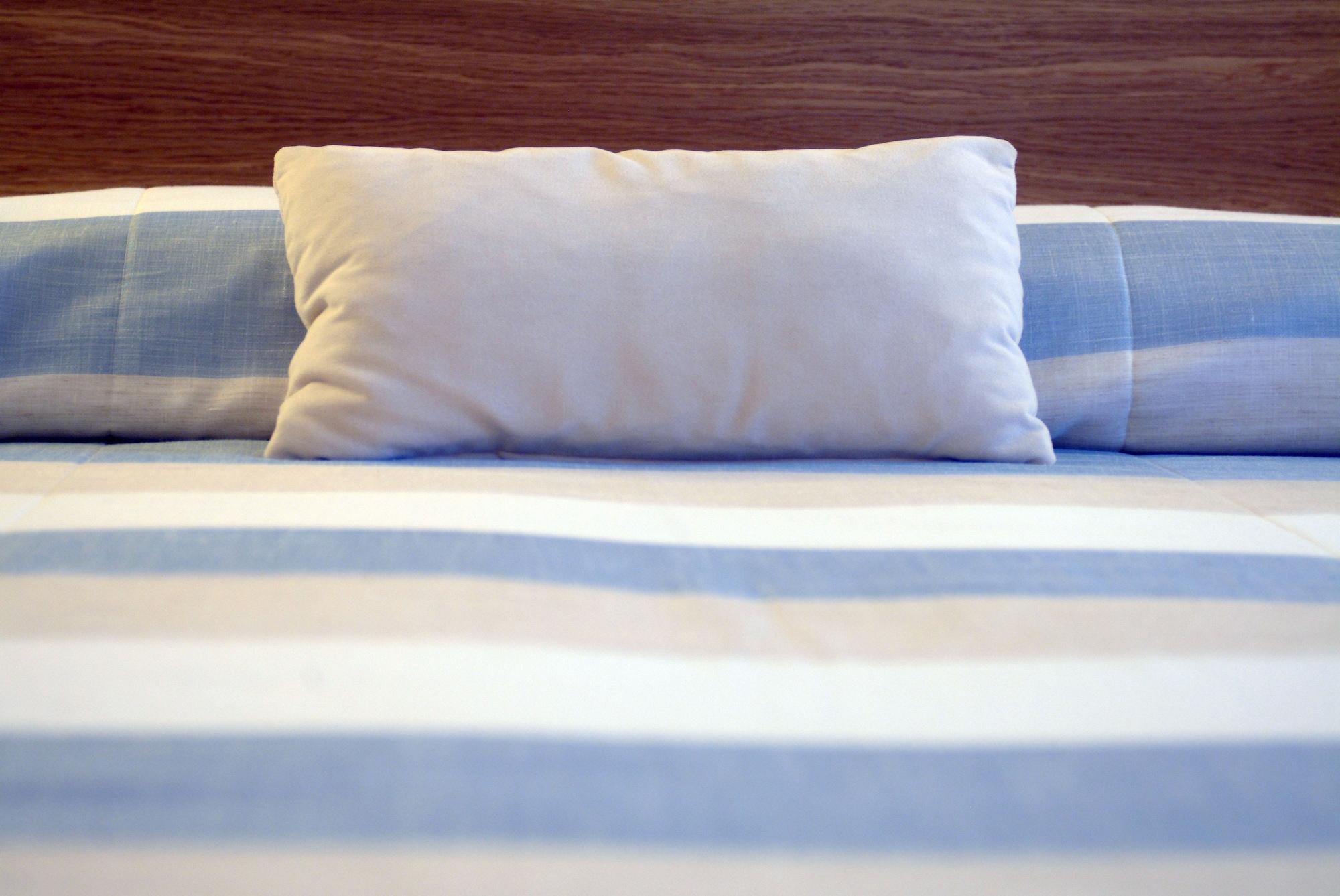 페스타나 카지노 파크 호텔 앤드 카지노 푼샬 외부 사진 A pillow on a bed